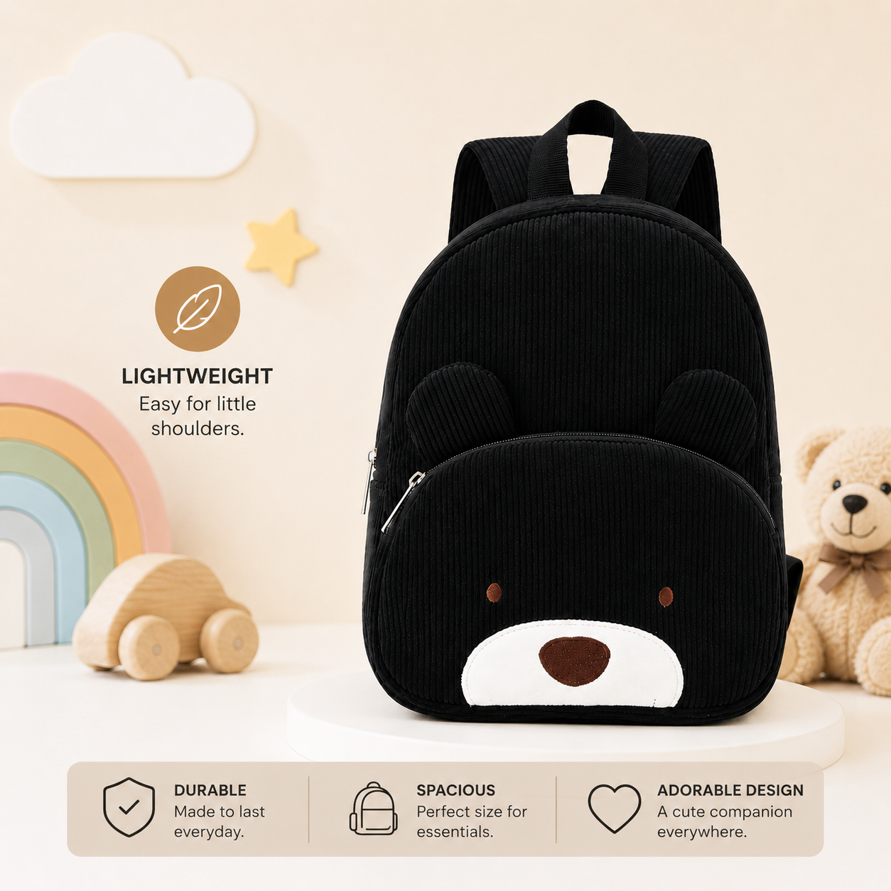 Black corduroy toddler backpack with a teddy bear design, featuring 3D ears, a white snout, and a brown embroidered nose and eyes